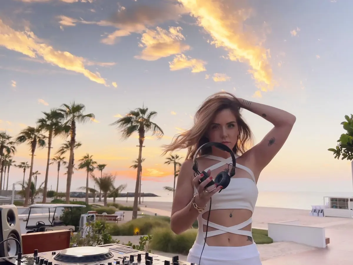 DJ performing at sunset by the sea in Dubai