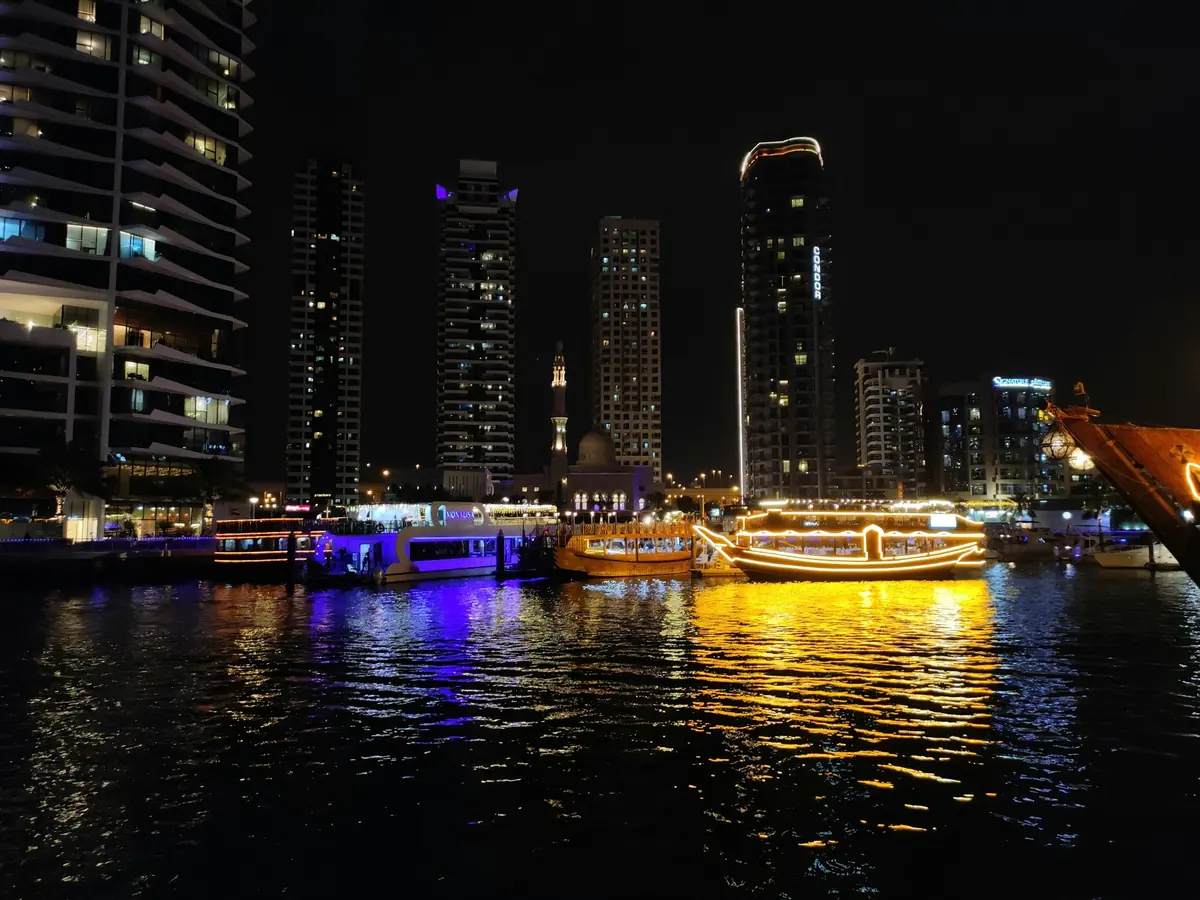 Illuminated yachts in Dubai Marina at night
