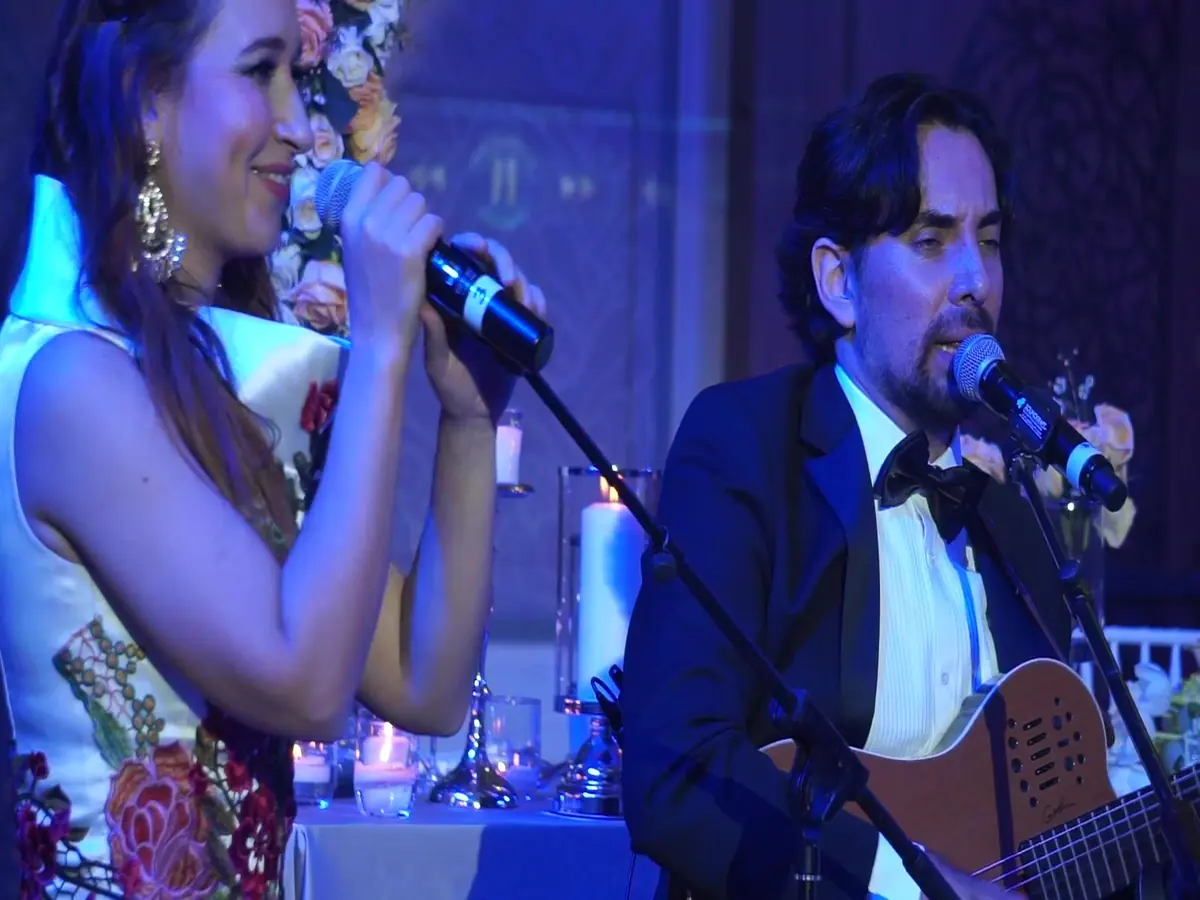 Live singer and guitarist duo performing at a private event in Dubai
