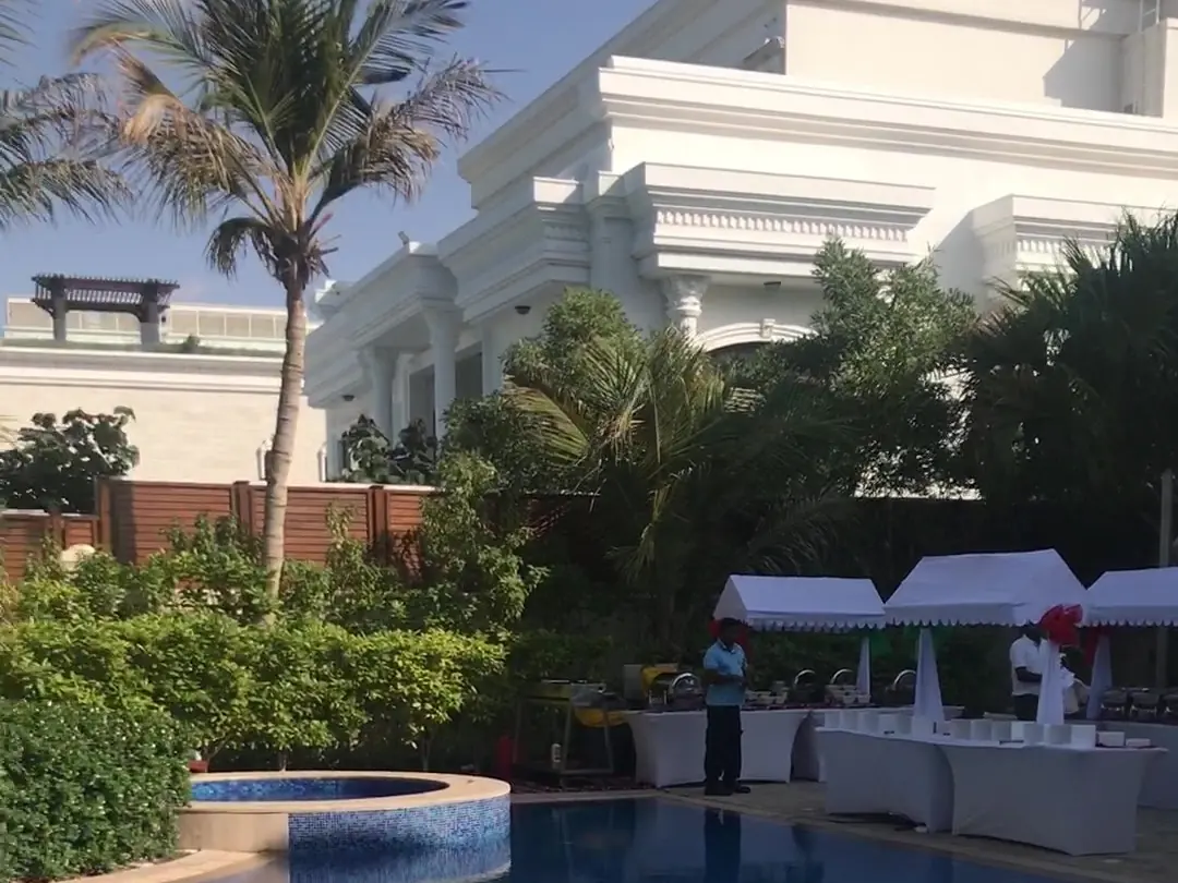 Private villa in Dubai with pool and tents set up for a party with live music