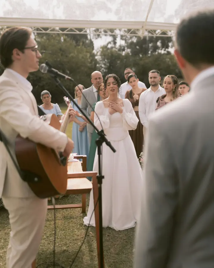 Live acoustic music during an outdoor wedding ceremony